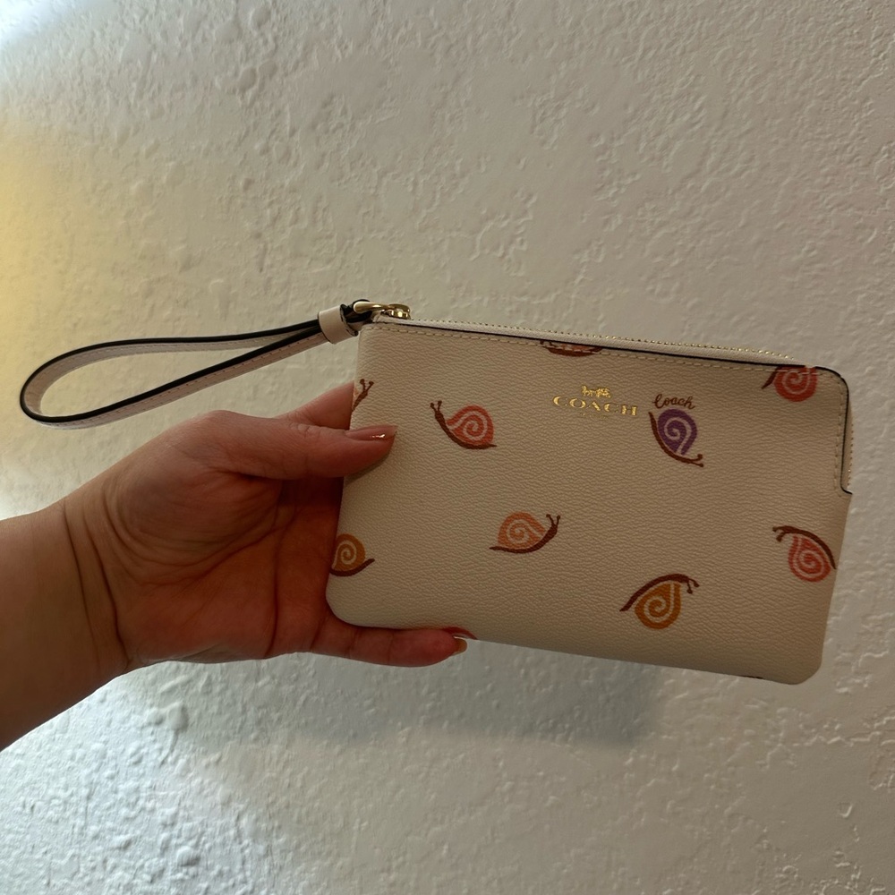Coach Beige Wristlet with Colorful Snail Design